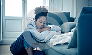 Depressed and distressed african american woman feeling lonely, sad and exhausted