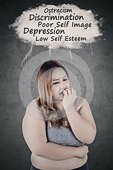 Depressed fat woman thinking her problems