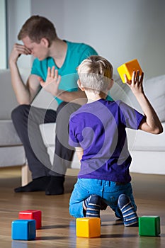 Depressed father ignores his son