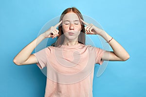 Depressed frustrated upset serious girl touching her temples