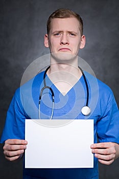 Depressed man with piece of paper photo