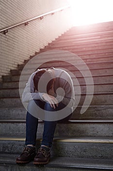 Depressed man sit in underground