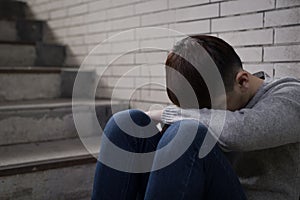 Depressed man sit in underground