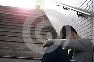 Depressed man sit in underground