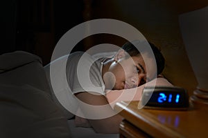 Depressed man suffering from insomnia photo