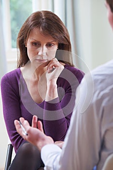 Depressed Mature Woman Talking To Counsellor