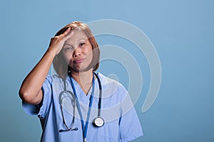 Depressed medical worker suffering from headache