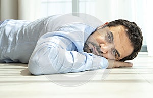 Depressed middle aged arab man on a floor