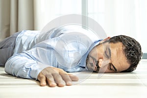 Depressed middle aged arab man on a floor