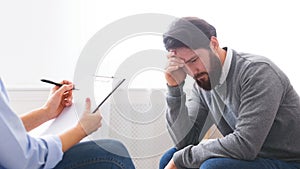 Depressed millennial man getting professional psychological help