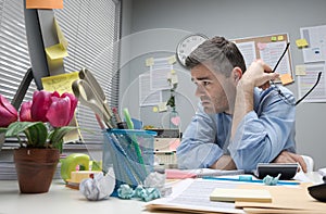 Depressed office worker at his desk