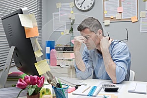 Depressed office worker at his desk