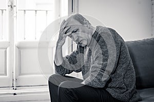 Depressed overwhelmed old man feeling exhausted alone and unhappy suffering from depression