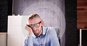 Depressed Sad Man With Headache Sitting