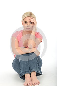 Depressed Sad Unhappy Young Woman Sitting Alone on the Floor Looking Bored