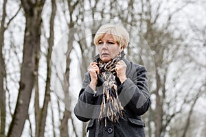 Depressed or sad woman walking in winter