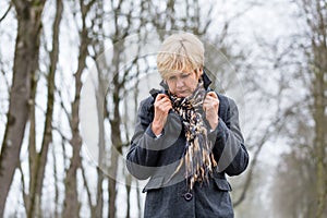 Depressed or sad woman walking in winter