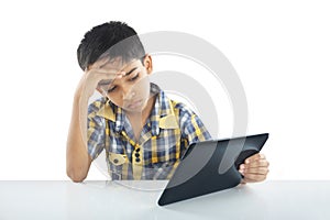 Depressed School boy with tablet