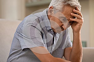 Depressed senior man at home