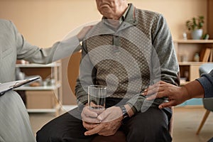 Depressed Senior Man in Support Group Meeting