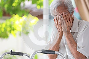Depressed senior woman covering face with hands,Lonely old people crying alone at home,loneliness,hopelessness,dejection,Sad photo