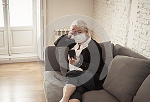 Depressed senior woman with facemask feeling lonely after loosing husband due to coronavirus