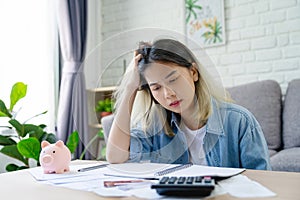Depressed and stressed young asian woman meet financial problem and she has no money to pay credit card debt bill after unemployed