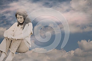 Depressed teen girl in clouds