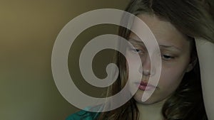 Depressed teen girl crying alone. 4K UHD.