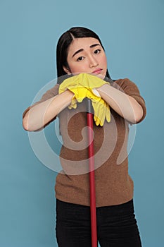 Depressed unhappy and tired asian houseworker takin some rest