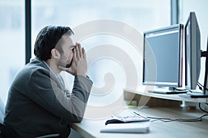Depressed upset office worker having a headache problem
