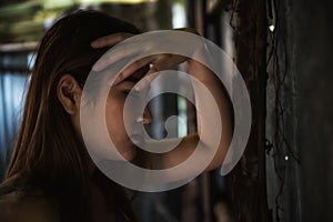 Depressed woman in abandon house