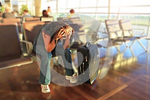 Depressed woman awaiting for plane