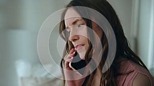 Depressed woman calling cell at night closeup. Unhappy stressed girl talking