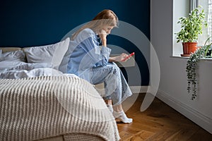 Depressed woman hold cellphone pondering bad offer worried work problem, difficult solution trouble