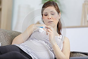 depressed woman holding pregnancy test