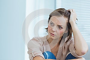 Depressed woman at home