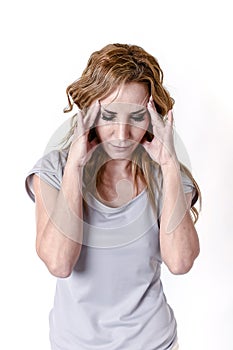 Depressed woman looking desperate in pain face expression suffering migraine and headache