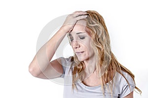 Depressed woman looking desperate in pain face expression suffering migraine and headache