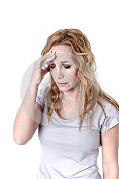 Depressed woman looking desperate in pain face expression suffering migraine and headache