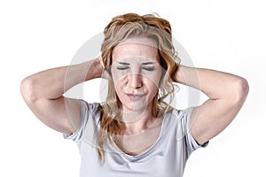 Depressed woman looking desperate in pain face expression suffering migraine and headache