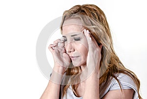 Depressed woman looking desperate in pain face expression suffering migraine and headache