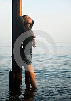 Depressed woman portrait on a sea beach mooring