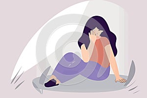 depressed woman sitting on the floor crying