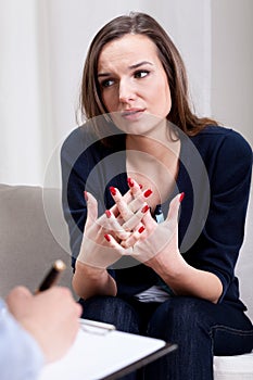 Depressed woman talking about problems