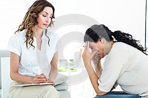 Depressed woman talking to her therapist