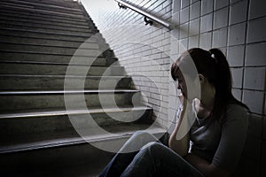 Depressed woman in underground
