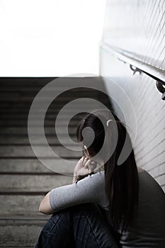 Depressed woman in underground