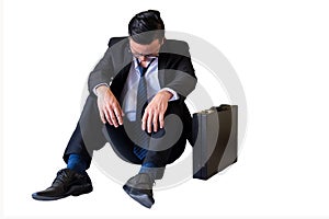 Depressed young Asian businessman isolated on white