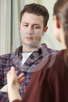 Depressed Young Man Talking To Counsellor photo